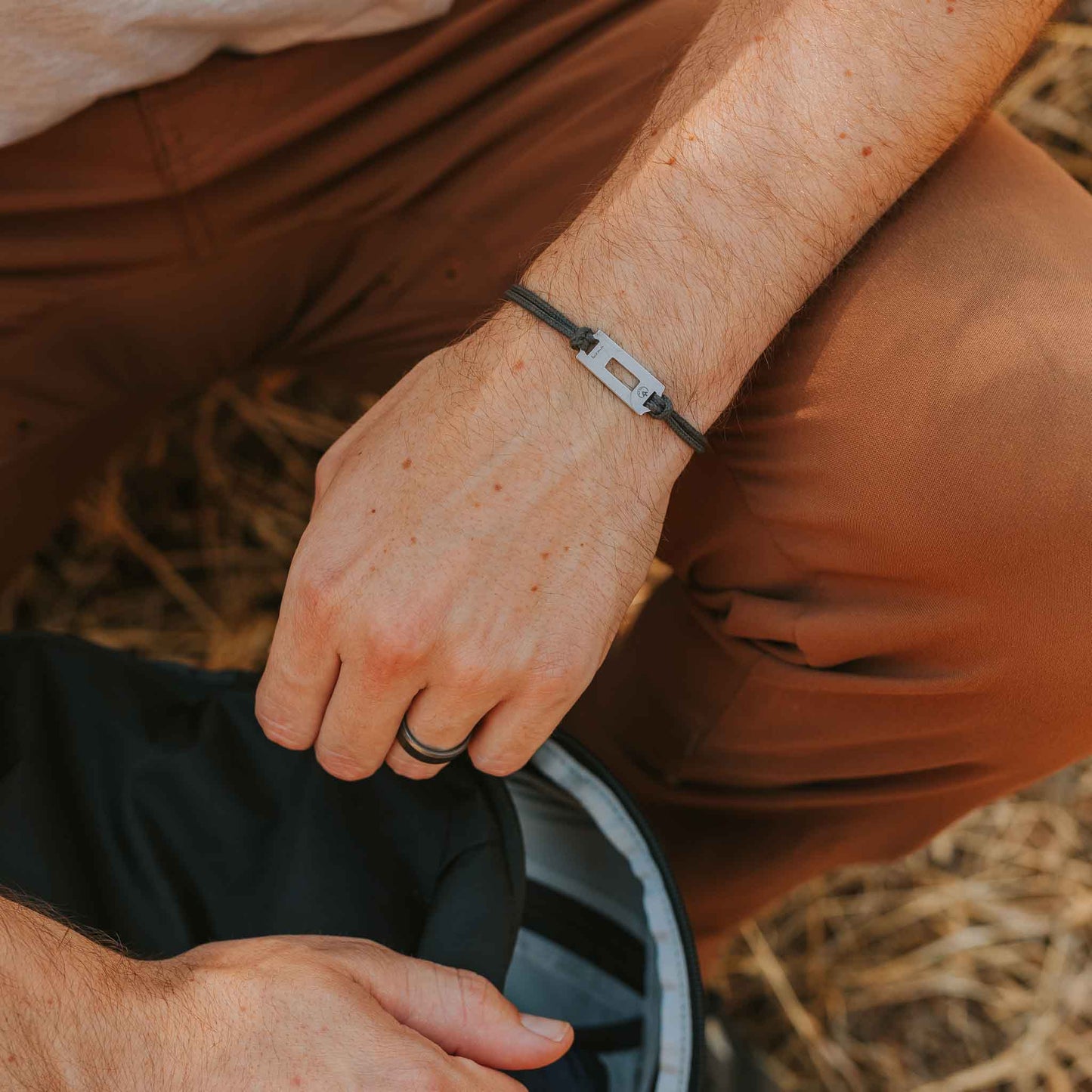 Man wearing stainless steel appalachian trail blaze marker bracelet