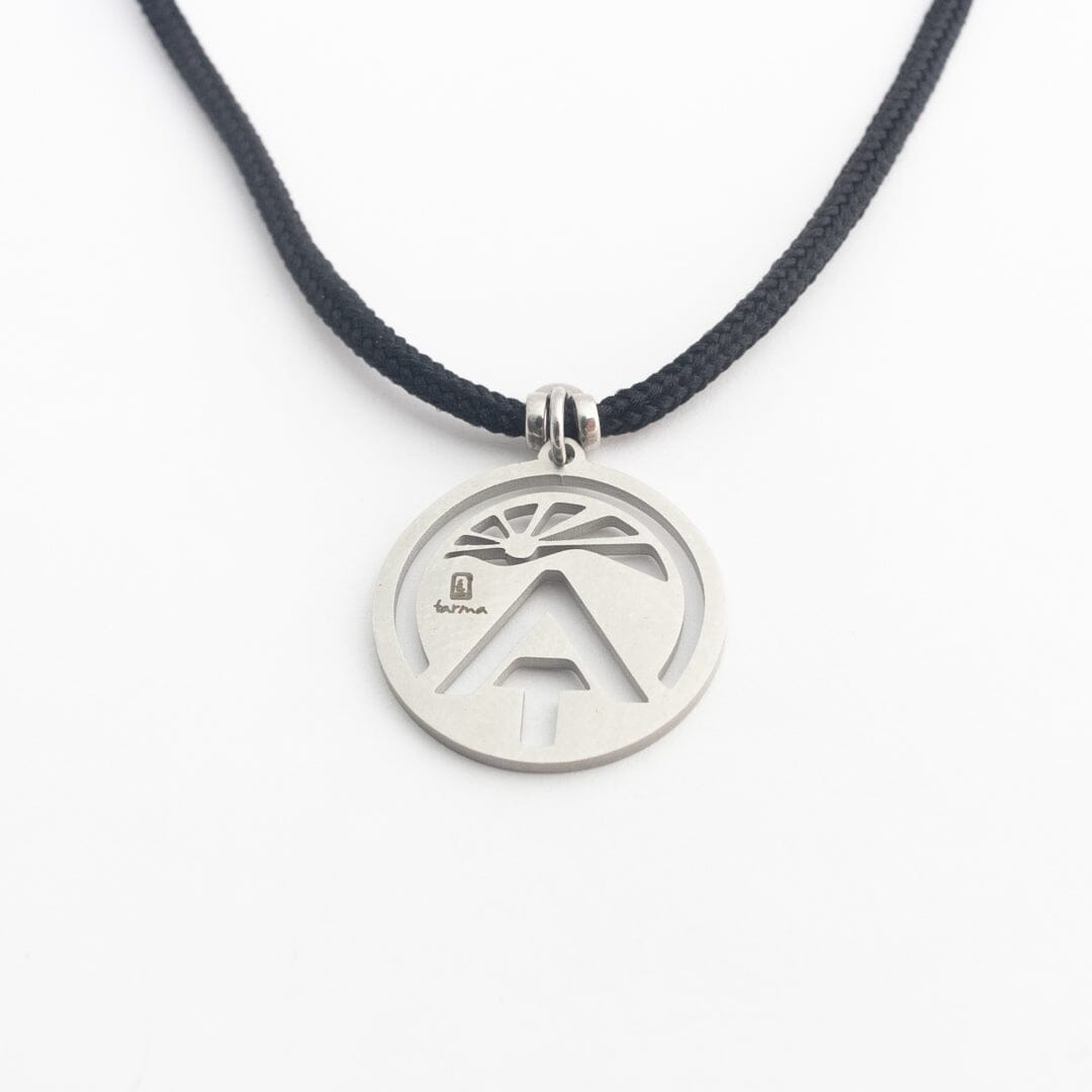 Stainless steel appalachian trail sunburst pendant on black paracord