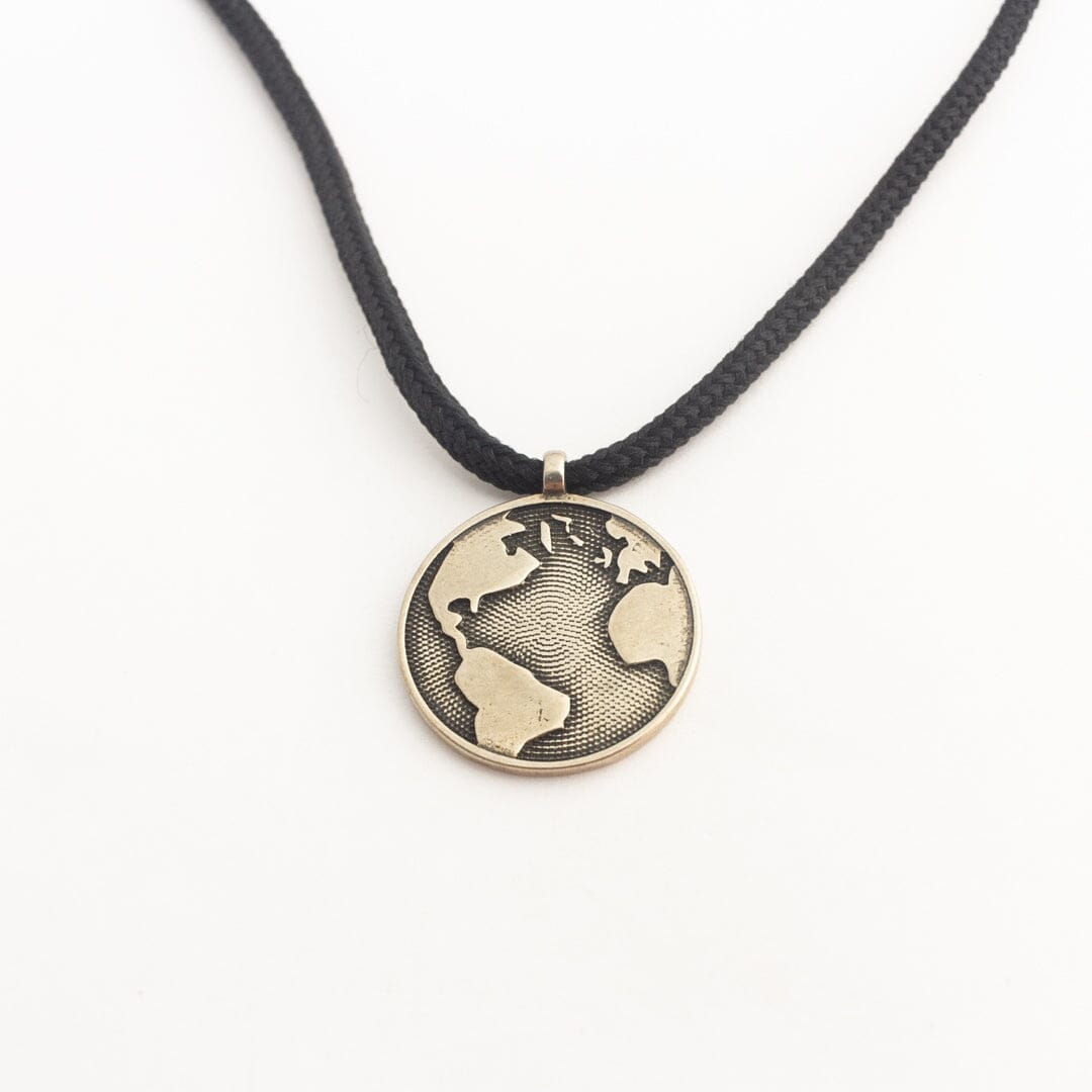 White bronze globe pendant on black paracord