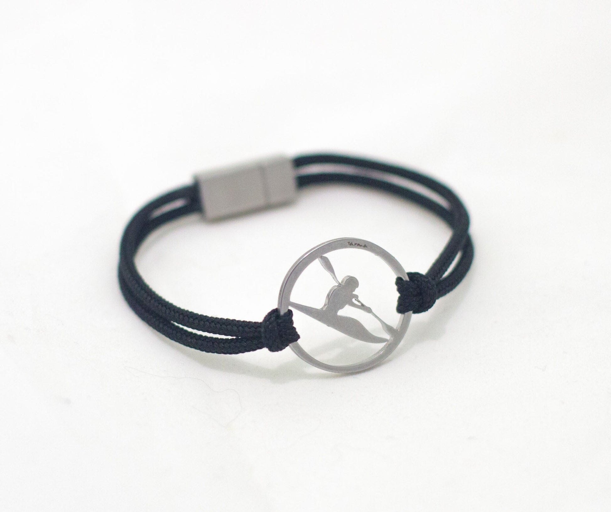 Stainless steel kayaker bracelet on black paracord