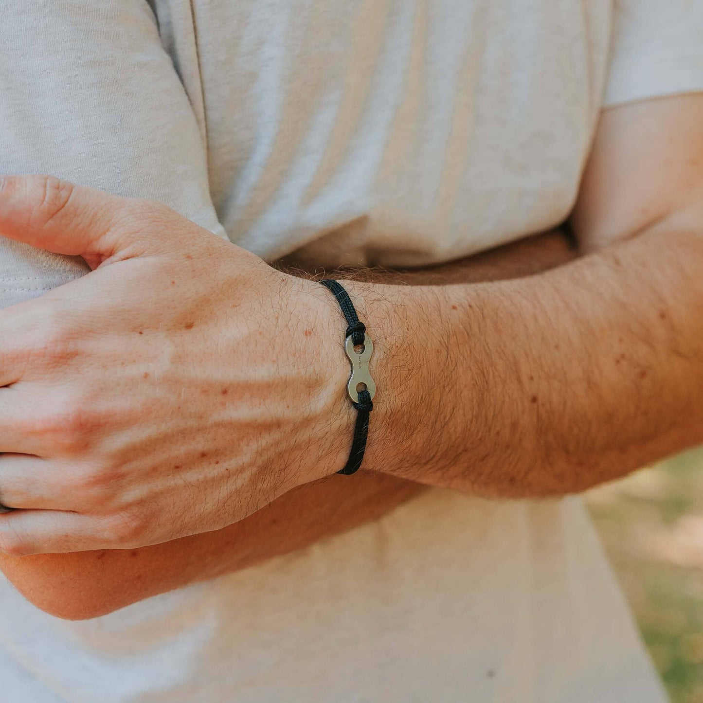 Man wearing stainless steel bike link bracelet