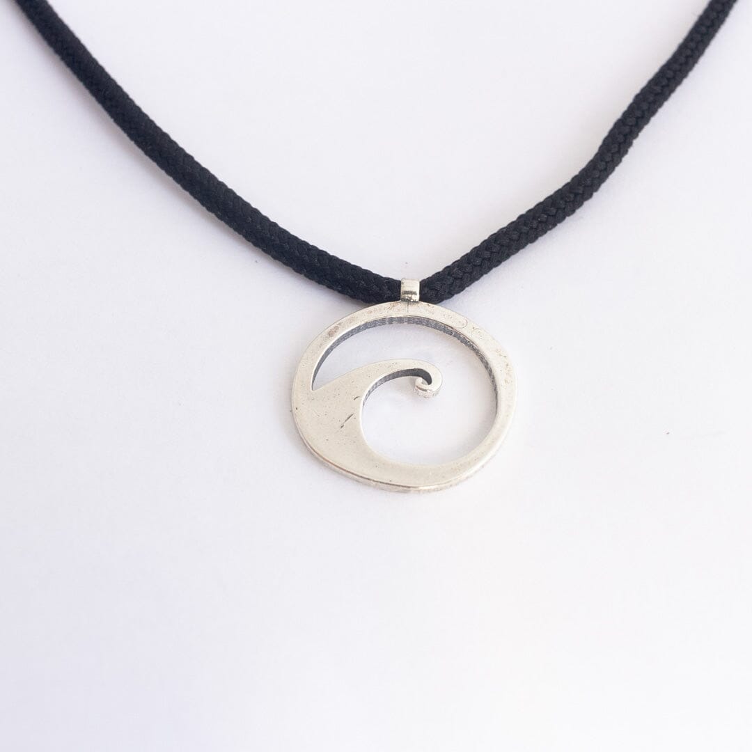 Sterling silver wave pendant on black paracord