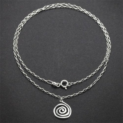 Sterling silver spiral charm necklace with an 18-inch chain