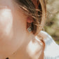 Girl wearing sterling silver appalachian trail earrings 