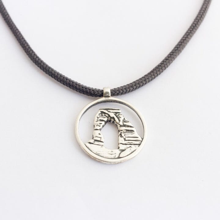 Delicate arch pendant on slate gray paracord