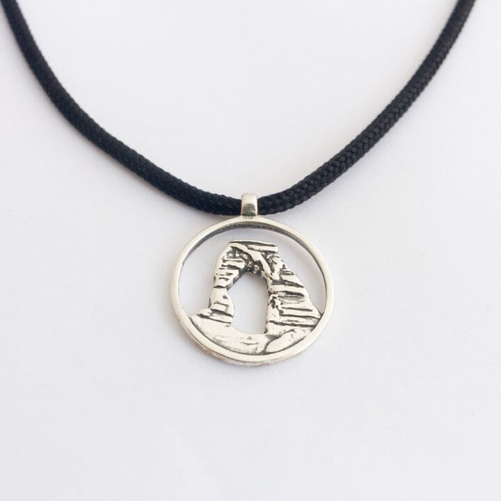 Delicate arch pendant in sterling silver on black paracord
