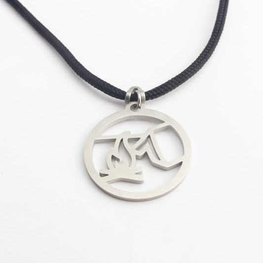 Stainless steel campfire pendant on black paracord
