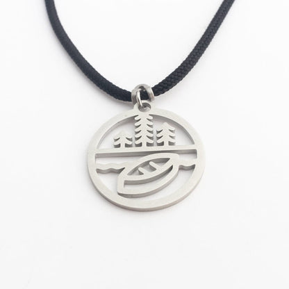 Stainless steel canoe and trees pendant on black paracord