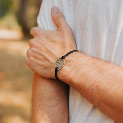 Man wearing stainless steel canoe canoeing bracelet