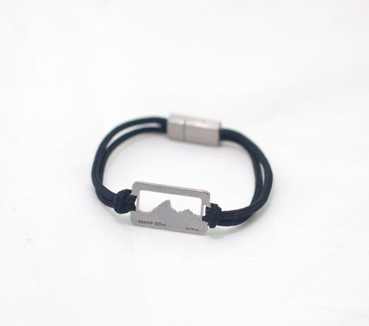 Stainless steel grand teton national park pendant bracelet on black paracord