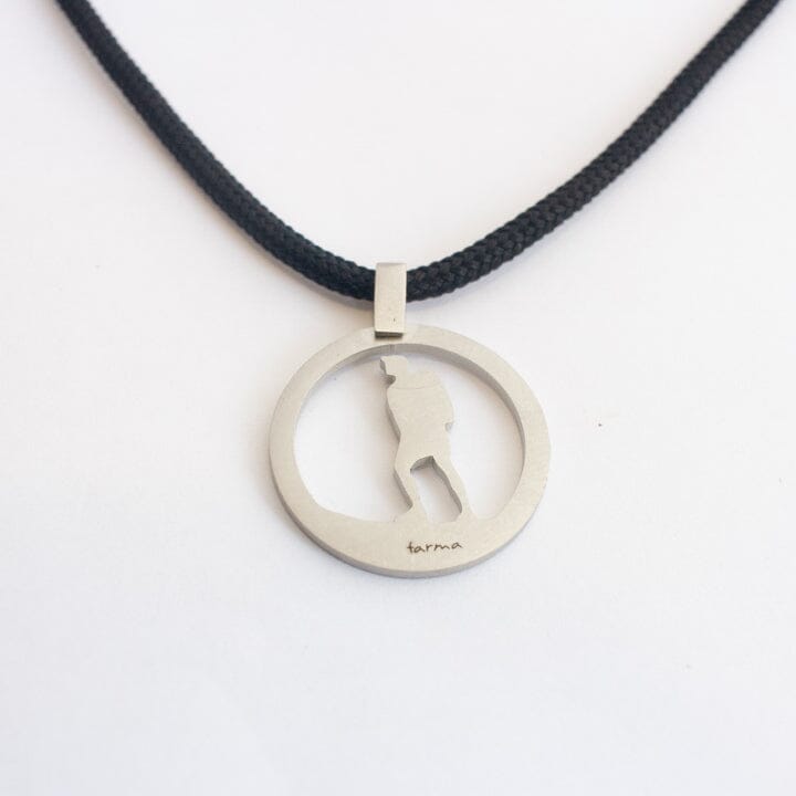 Stainless steel hiking guy pendant on black paracord