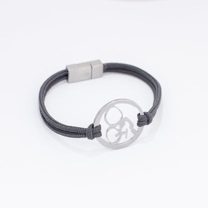 Stainless steel mountain bike bracelet on slate paracord