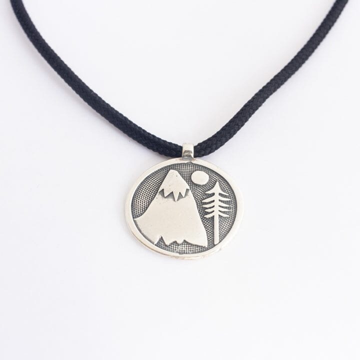 Sterling silver mountain necklace on black paracord