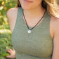 Women wearing sterling silver coyote pendant on black paracord