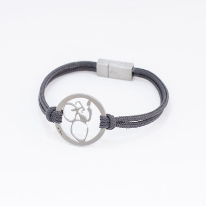 Stainless steel road bike bracelet on slate paracord