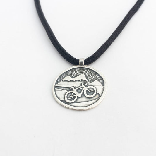 Sterling silver road bike pendant on black paracord