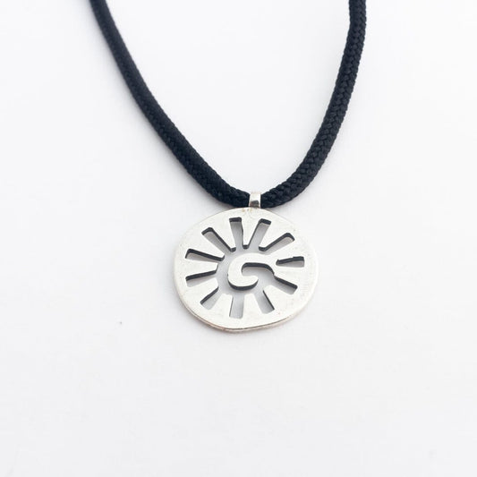 Sterling silver sun pendant on black paracord
