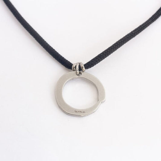 Stainless steel zen circle pendant on black paracord